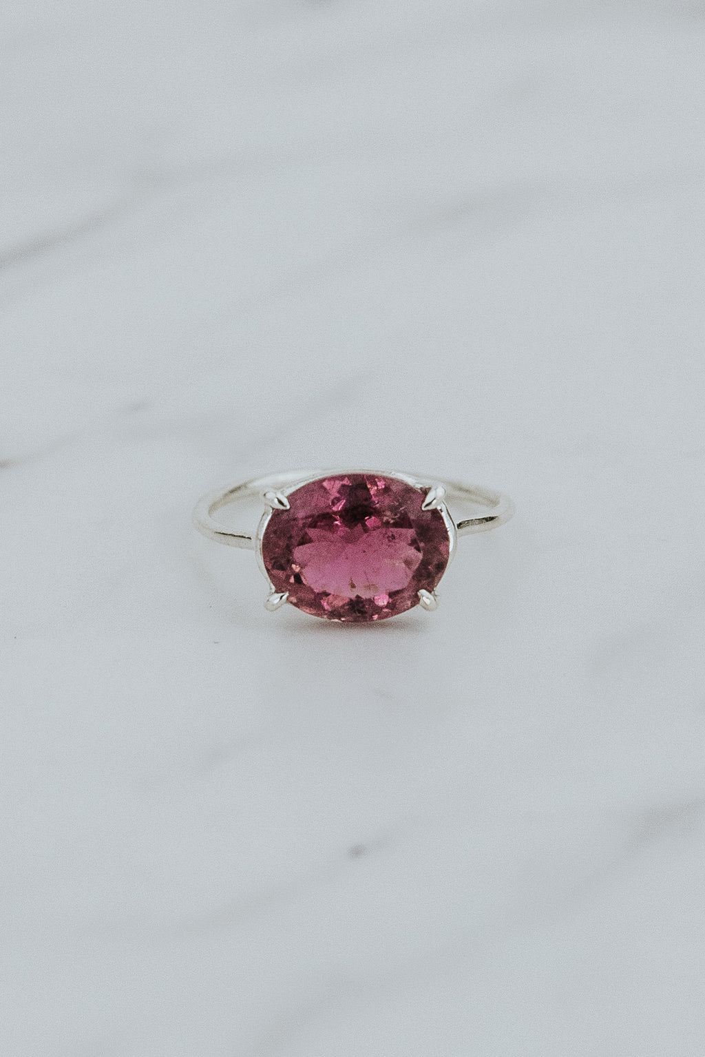 Wings Hawaii Halo ring – Rose Pink Tourmaline in sterling silver. Fine jewelry handcrafted in Maui. Oval-cut gemstone, single prong-set on delicate band. Made in Hawaii gifts. 
