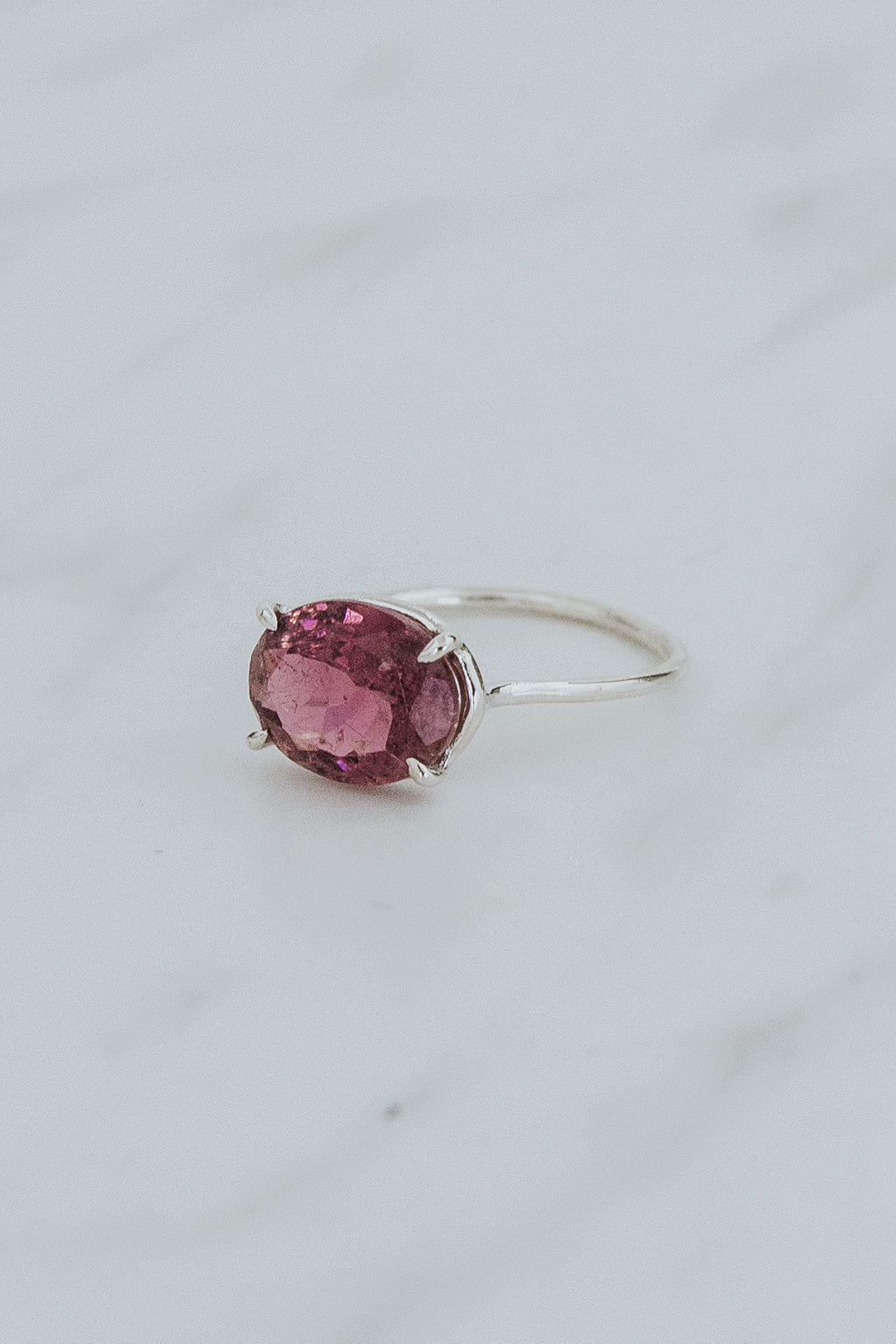 Wings Hawaii Halo ring – Rose Pink Tourmaline in sterling silver. Fine jewelry handcrafted in Maui. Oval-cut gemstone, single prong-set on delicate band. Made in Hawaii gifts. 