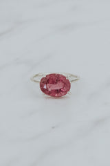 Wings Hawaii Halo ring – Bright Pink Tourmaline in sterling silver. Fine jewelry handcrafted in Maui. Oval-cut gemstone, single prong-set on delicate band. Made in Hawaii gifts. 