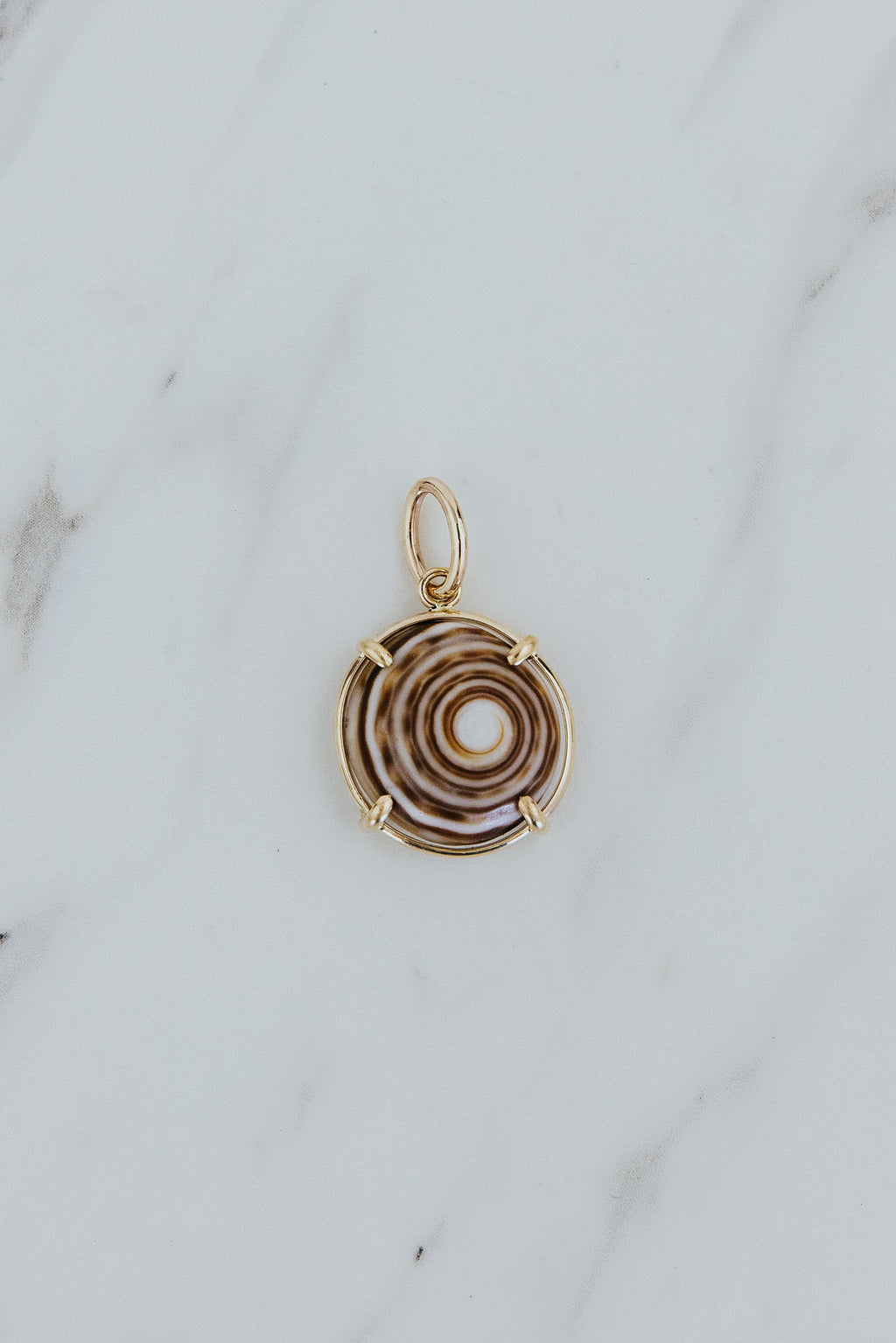 Wings Hawaii prong-set puka shell necklace charm in 14k gold-filled. Fine jewelry handmade in Maui. Authentic Hawaiian shell modern charm necklaces handmade in Hawaii. 