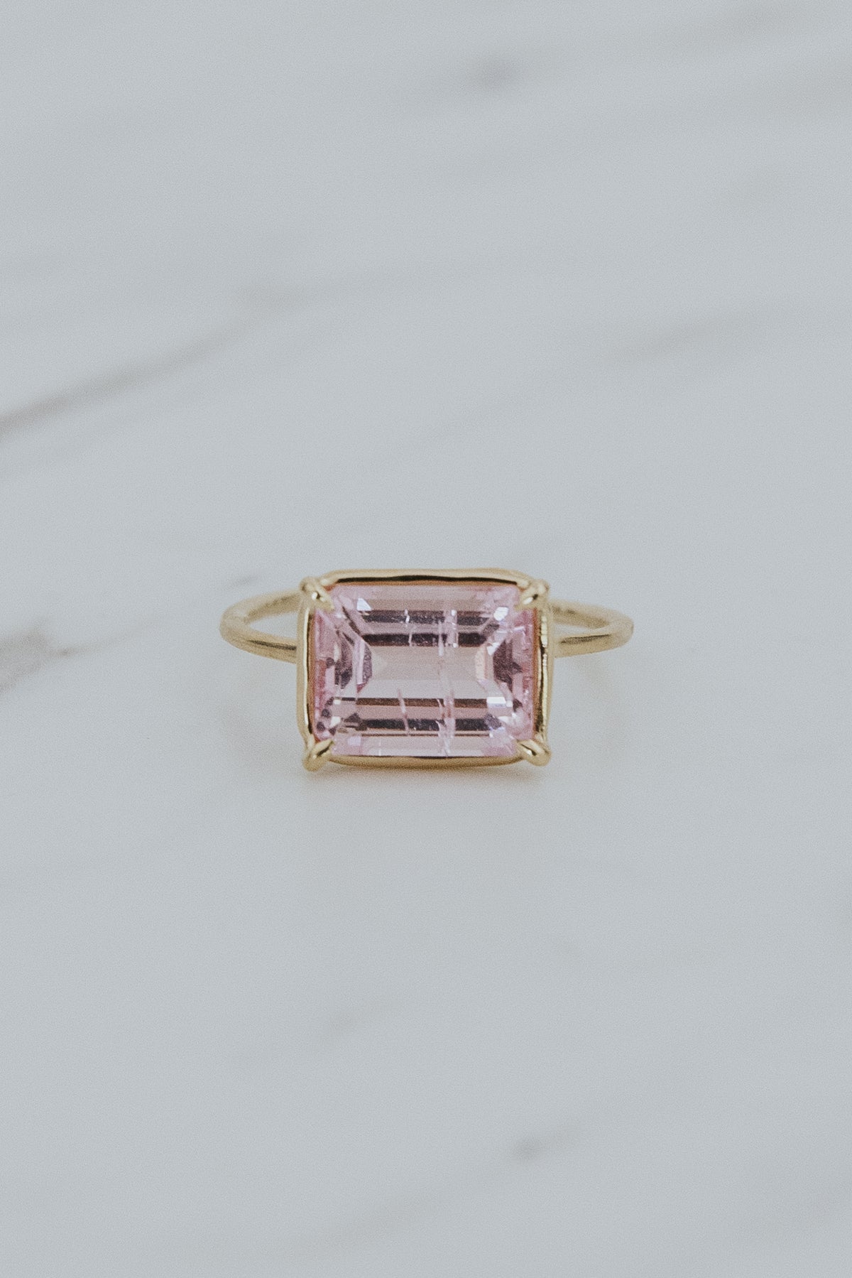 Wings Hawaii Astra ring – Pink Tourmaline in solid 14k yellow gold. Fine jewelry handcrafted in Maui. Rectangle gemstone, single prong-set on delicate band. Unique jewelry gifts made in Hawaii. 