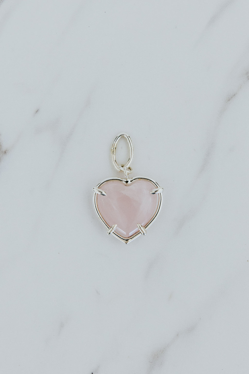 Wings Hawaii heart-shaped crystal necklace charms in 14k gold-filled or sterling silver. Available in Rose Quartz, Tigers Eye, Flourite, and Amethyst. Fine jewelry gifts handmade in Maui. 