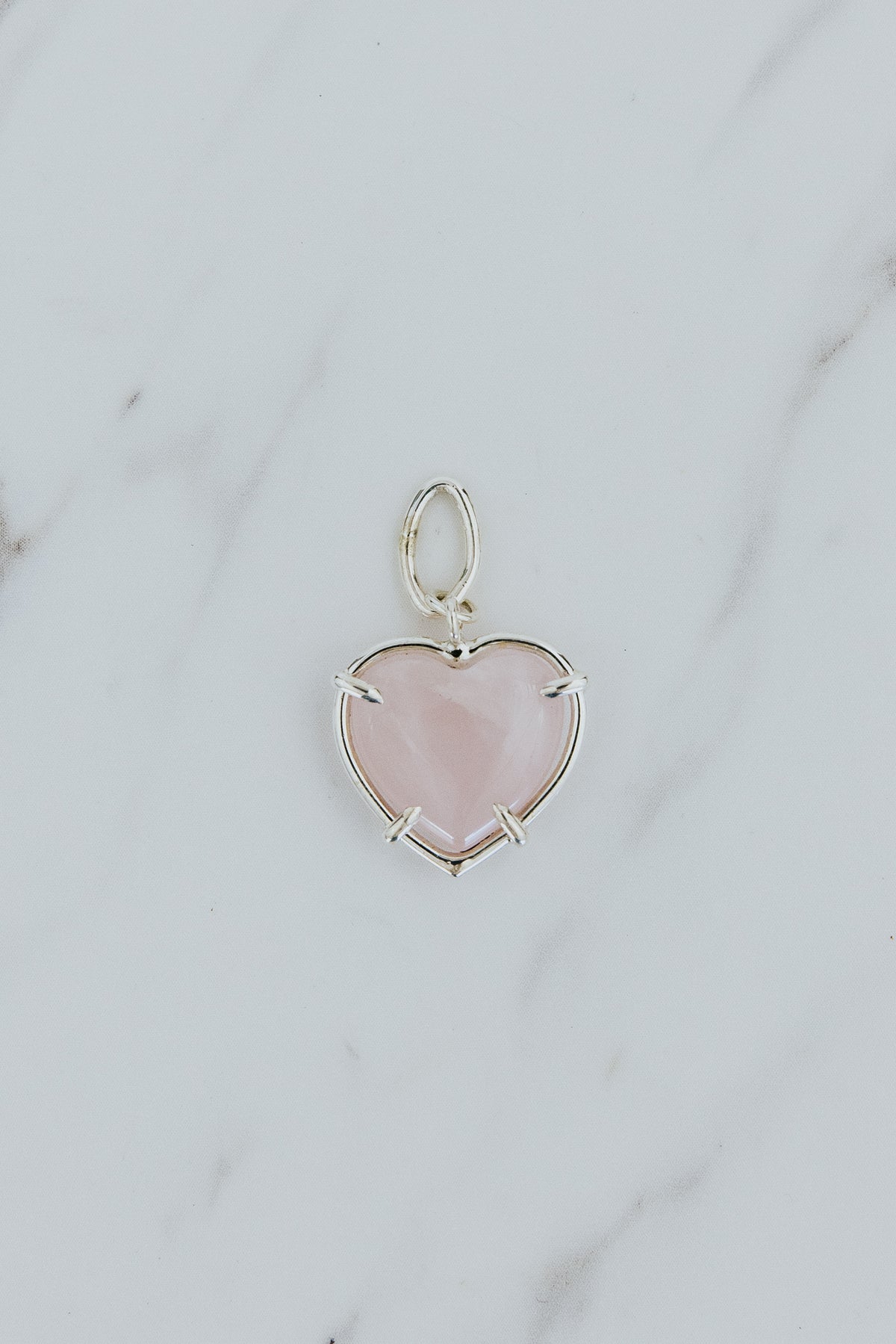 Wings Hawaii heart-shaped crystal necklace charms in 14k gold-filled or sterling silver. Available in Rose Quartz, Tigers Eye, Flourite, and Amethyst. Fine jewelry gifts handmade in Maui. 