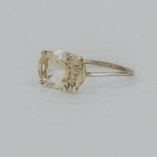A Yellow Oval Cut Sunstone Prong set onto a sterling silver ring