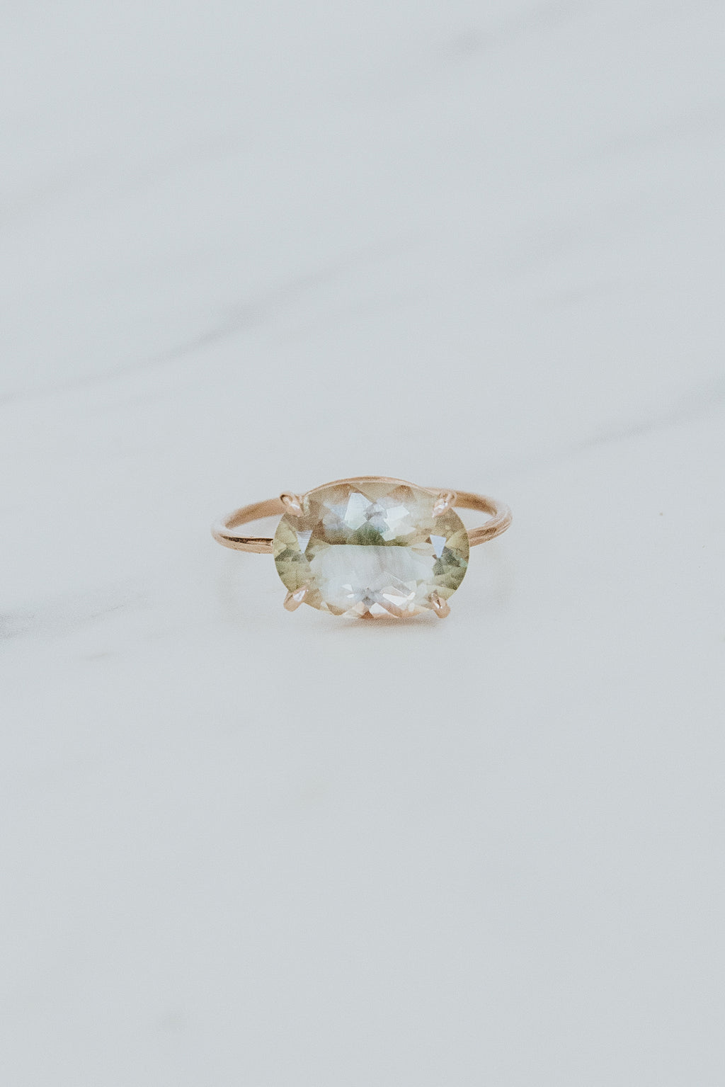 wings hawaii Halo Ring with prong set oval sunstone in 14k rose gold. Fine Jewelry handmade in Maui.