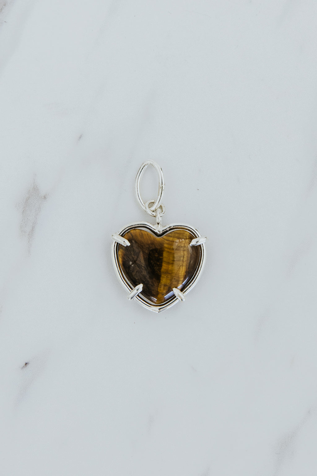 Wings Hawaii heart-shaped crystal necklace charms in 14k gold-filled or sterling silver. Available in Rose Quartz, Tigers Eye, Flourite, and Amethyst. Fine jewelry gifts handmade in Maui. 