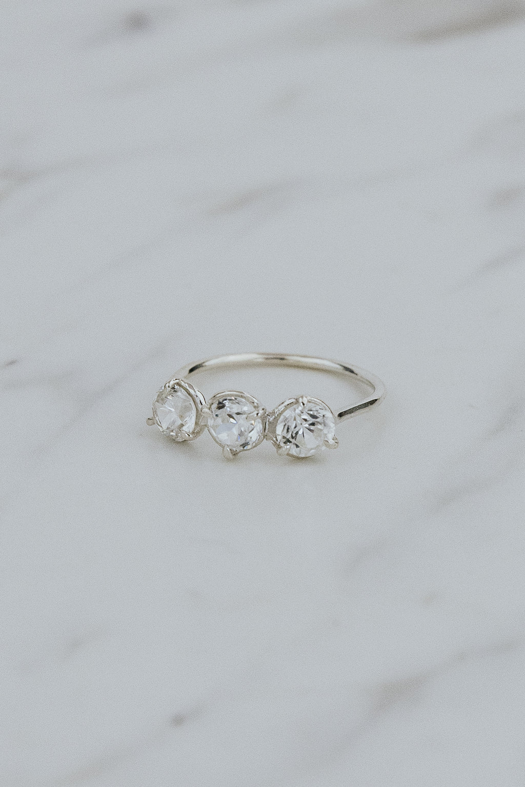 Wings Hawaii Triplet Ring with Clear Zircon gemstones in sterling silver. Fine jewelry handcrafted in Maui. Number three symbolic jewelry gift. 