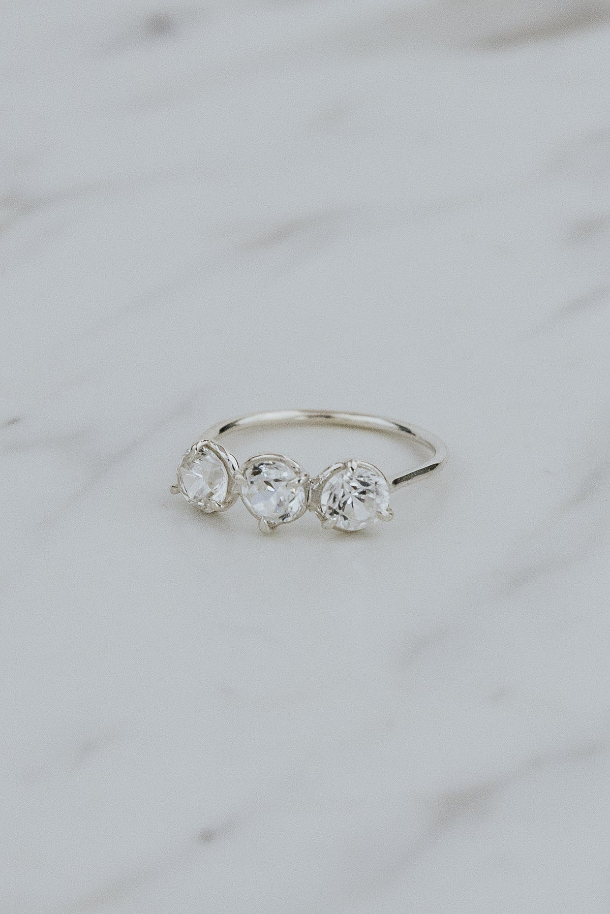 Wings Hawaii Triplet Ring with Clear Zircon gemstones in sterling silver. Fine jewelry handcrafted in Maui. Number three symbolic jewelry gift. 