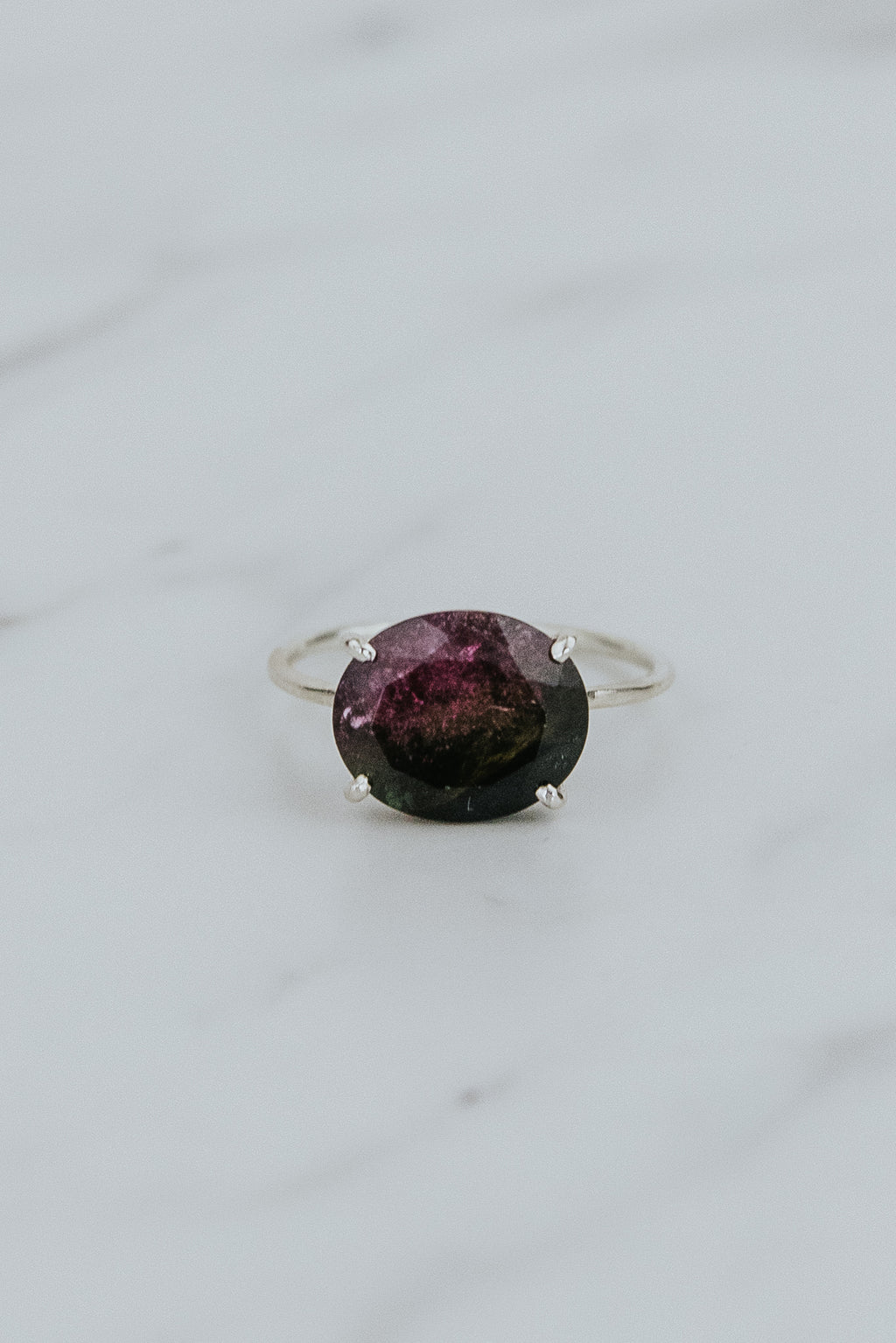 Wings Hawaii Halo ring – Watermelon Tourmaline in sterling silver. Fine jewelry handcrafted in Maui. Oval-cut gemstone, single prong-set on delicate band. Made in Hawaii gifts. 