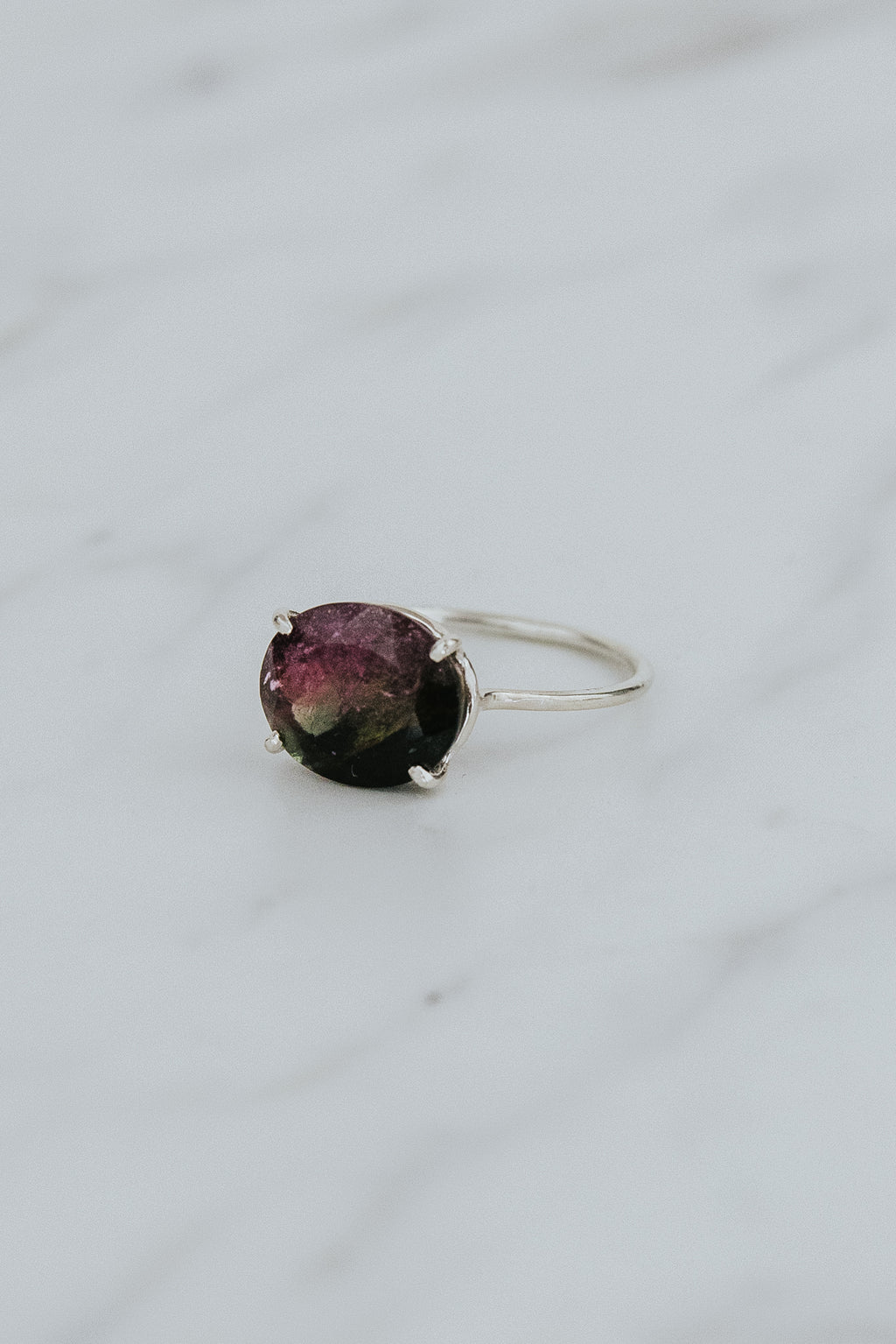 Wings Hawaii Halo ring – Watermelon Tourmaline in sterling silver. Fine jewelry handcrafted in Maui. Oval-cut gemstone, single prong-set on delicate band. Made in Hawaii gifts. 