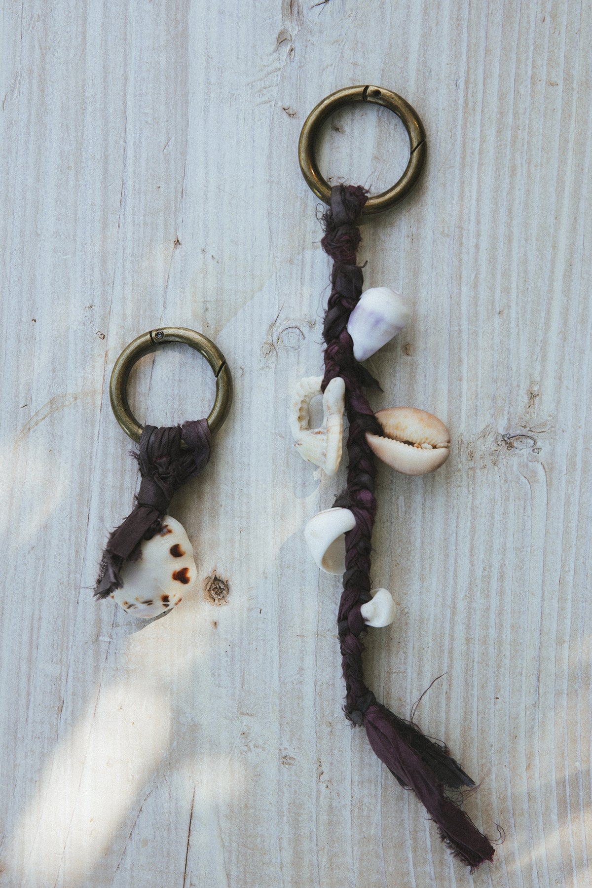 Wings Hawaii Shell Purse Charms Keychains with real Hawaiian beach shells and jewel tone braided silk ribbon on a brass ring. Handmade in Maui. Great gift or island souvenir. 