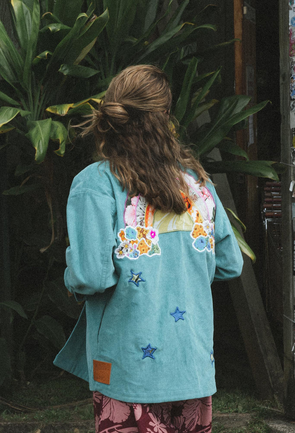 Wings Hawaii Rainbow Field Jacket. Teal blue oversized corduroy jacket with rainbow design in upcycled aloha fabric. Handmade and hand-sewn in Haiku, Maui. Perfect beach coverup or winter layer. 