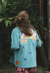 Wings Hawaii Rainbow Field Jacket. Teal blue oversized corduroy jacket with rainbow design in upcycled aloha fabric. Handmade and hand-sewn in Haiku, Maui. Perfect beach coverup or winter layer.  thumbnail