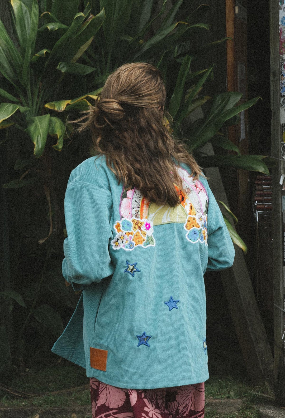 Wings Hawaii Rainbow Field Jacket. Teal blue oversized corduroy jacket with rainbow design in upcycled aloha fabric. Handmade and hand-sewn in Haiku, Maui. Perfect beach coverup or winter layer. 