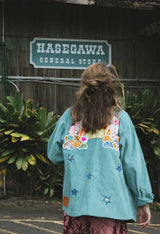 Wings Hawaii Rainbow Field Jacket. Teal blue oversized corduroy jacket with rainbow design in upcycled aloha fabric. Handmade and hand-sewn in Haiku, Maui. Perfect beach coverup or winter layer. One of a kind.  thumbnail