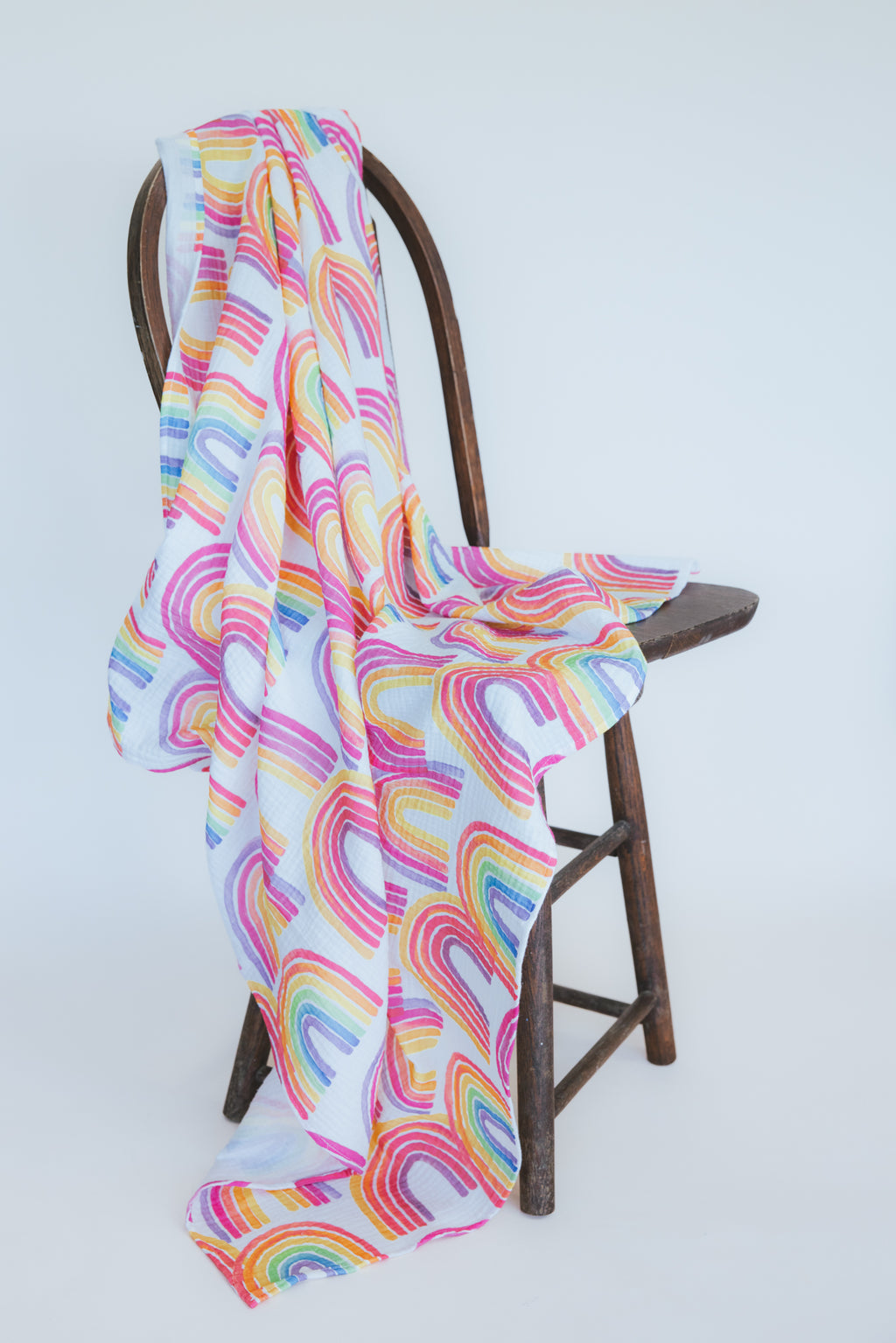 Wings Hawaii baby swaddle blanket with rainbows print. Original artwork designed in Maui. Best baby shower gifts, nursing cover, new mommy gifts. Island style keiki accessories. 