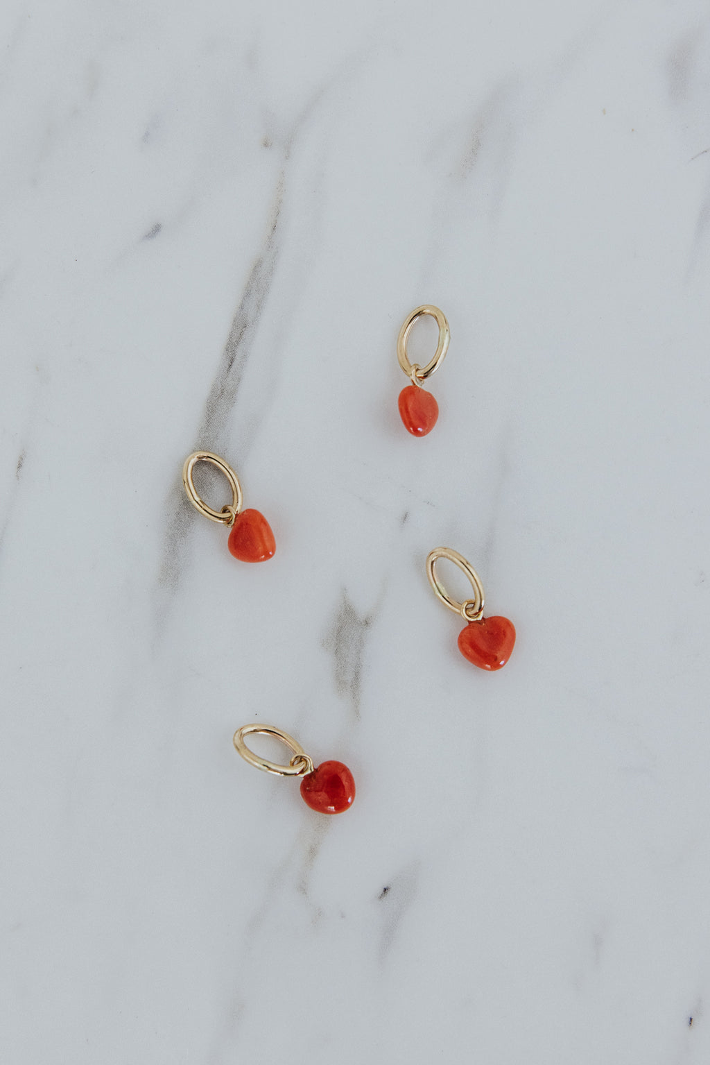 Wings Hawaii vintage red coral puffed heart charms in 14k gold-filled. Fine jewelry handmade in Maui. Mix, match, customize modern charm necklaces made in Hawaii. 