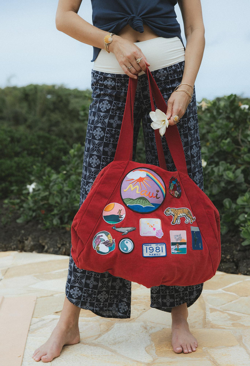 Wings Hawaii patched up cotton duffel bag in red. Original artwork on embroidered patches - mermaids, surfer girls, whales, tigers, rainbows and more. Handmade with aloha in Maui. 