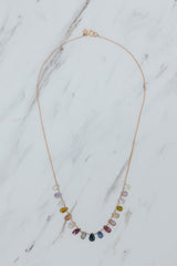 Wings Hawaii sapphire crown jewels necklace in 14k rose gold. A rainbow display of various Sapphire gemstone hues. Fine jewelry handmade in Maui. Unique handcrafted gifts from Hawaii.  thumbnail