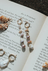 Wings Hawaii Mix Match Charm Hoops with real Hawaiian shells and pink freshwater pearls. Asymmetrical beachy mermaid earrings. Fine jewelry handmade in Maui. 