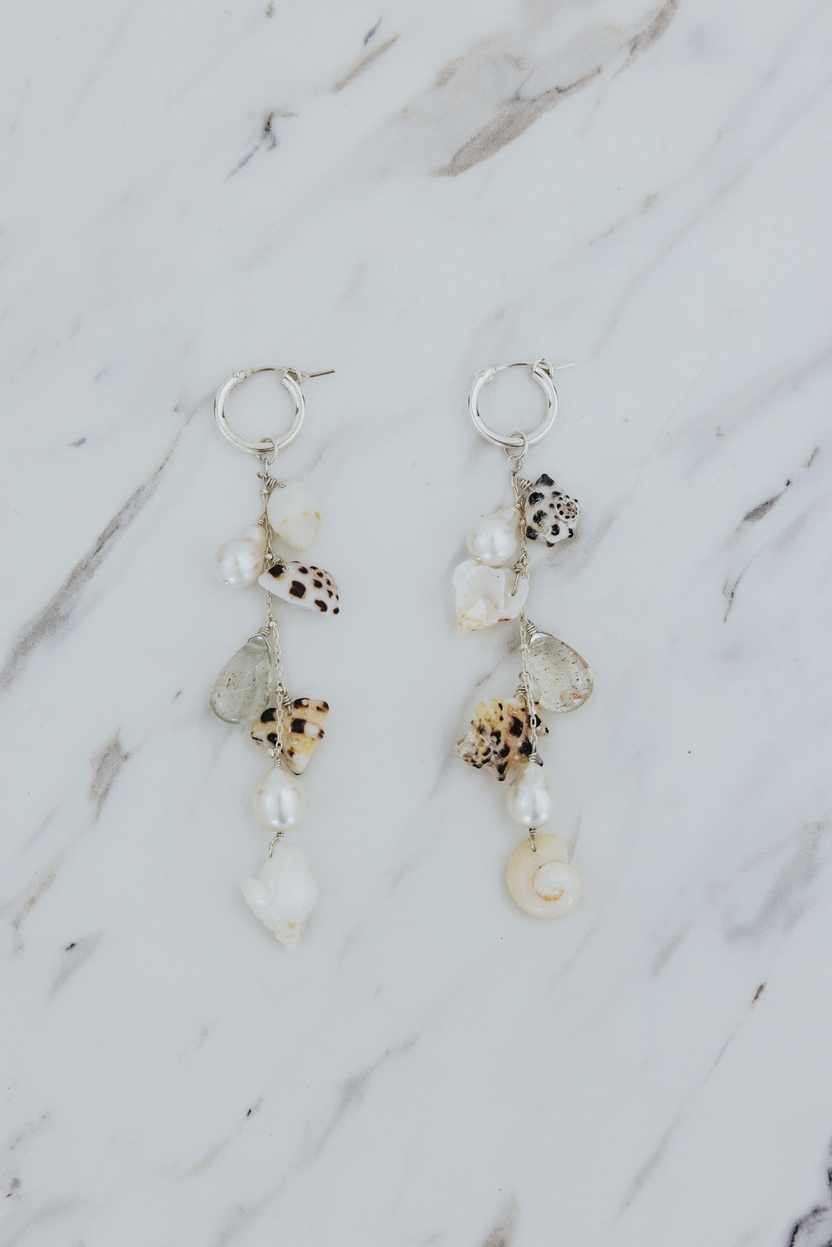 Wings Hawaii Shell Pile Charm Hoops earrings in sterling silver with real Hawaiian beach shells, pearls, and aquamarine beads. Fine jewelry handmade in Maui. 