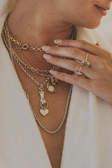 Model wearing Wings Hawaii Stolen Heart Necklace, shown layered with others  thumbnail