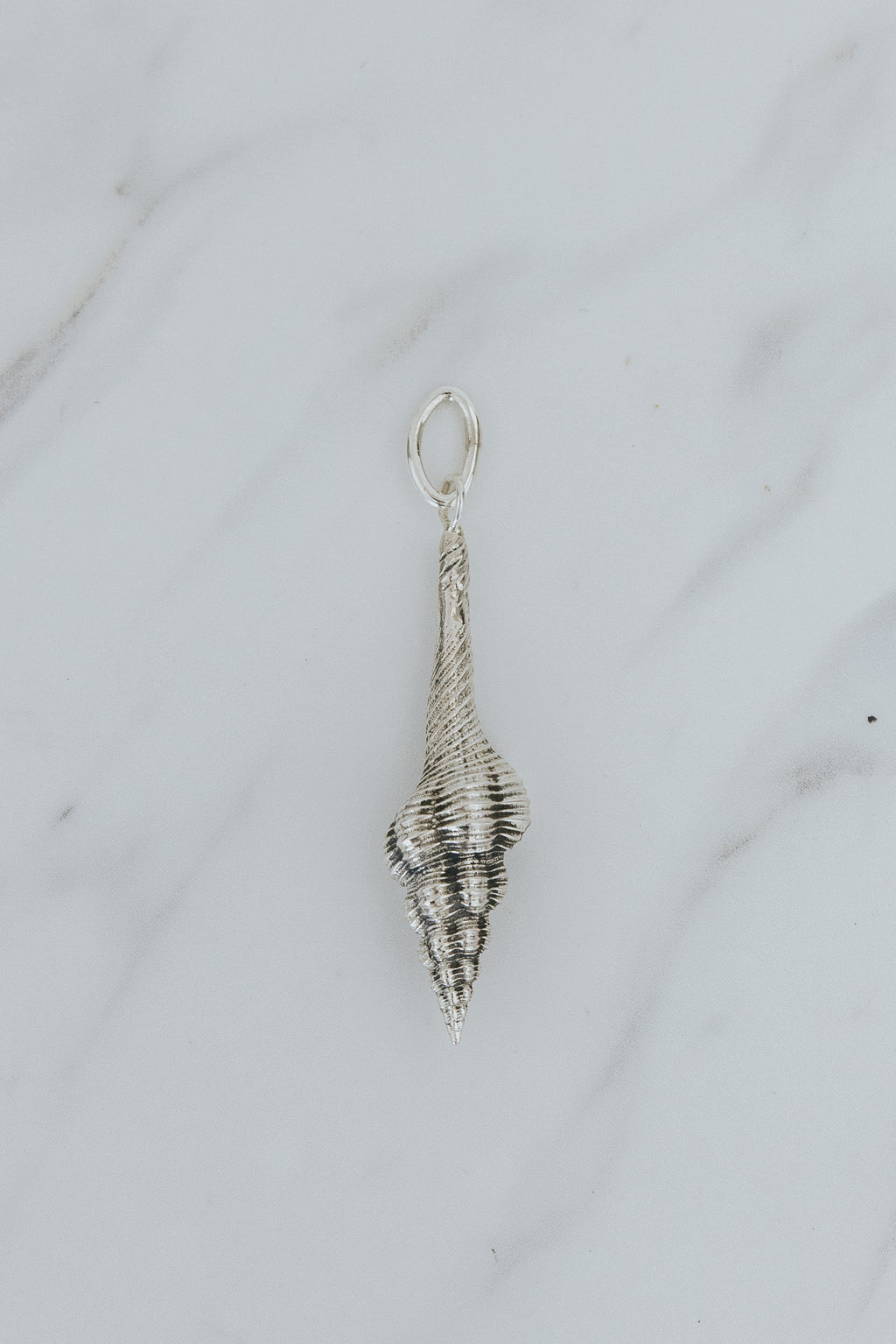 Wings Hawaii Forever Spindle Shell necklace charm in sterling silver. Also available in solid 14k yellow gold. Fine jewelry handmade in Maui. 
