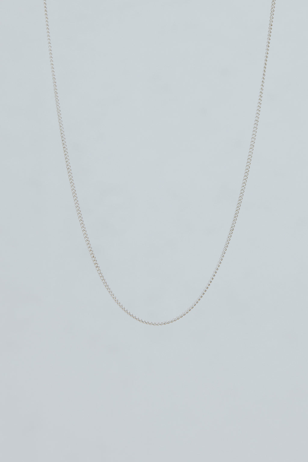 Wings Hawaii delicate 1.2mm curb chain necklace in sterling silver. 17" length. Fine jewelry handcrafted with aloha in Maui. Wear solo, layered, or add charms to customize. High quality jewelry made in Hawaii. 