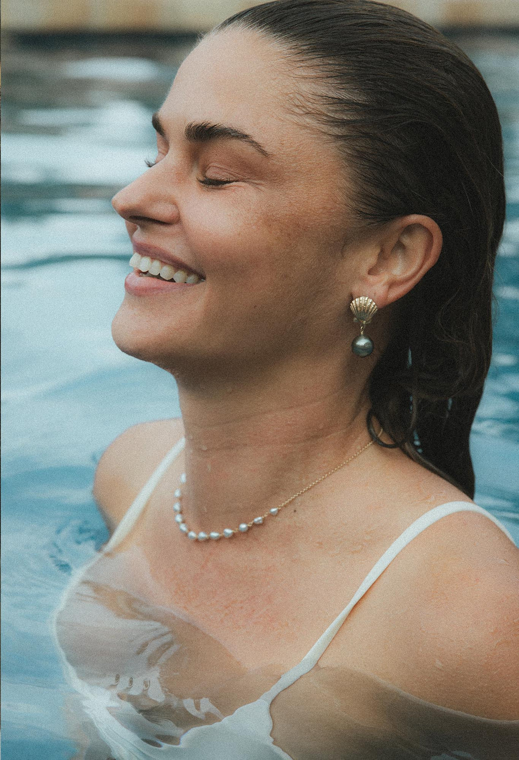 Wings Hawaii Siren Song Stud Earrings in solid 14k gold Sunrise Shells and Tahitian Pearls. Fine jewelry handcrafted in Maui. 