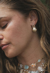 Wings Hawaii Siren Solstice Earrings with Red Schiller Sunstones and Sunrise Shells in solid 14k gold. Hinged for unique movement. Fine jewelry expertly handcrafted in Maui.  thumbnail