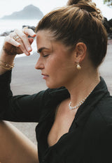 Wings Hawaii Siren Solstice Earrings with Red Schiller Sunstones and Sunrise Shells in solid 14k gold. Hinged for unique movement. Fine jewelry expertly handcrafted in Maui.  thumbnail