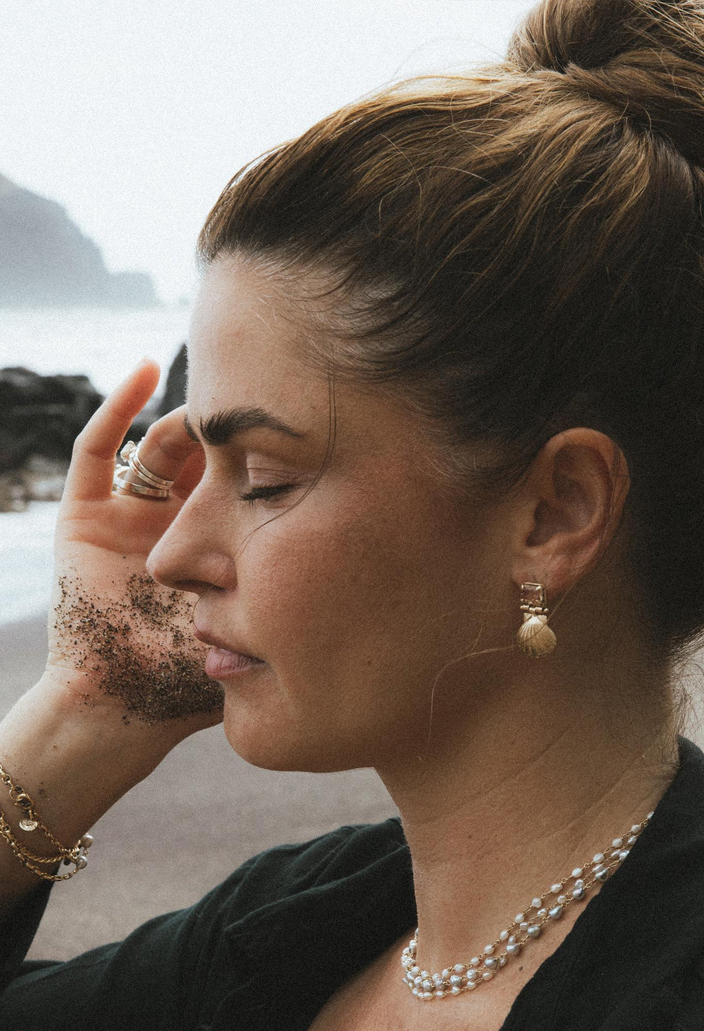 Wings Hawaii Siren Solstice Earrings with Red Schiller Sunstones and Sunrise Shells in solid 14k gold. Hinged for unique movement. Fine jewelry expertly handcrafted in Maui. 