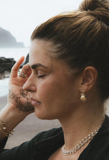 Wings Hawaii Siren Solstice Earrings with Red Schiller Sunstones and Sunrise Shells in solid 14k gold. Hinged for unique movement. Fine jewelry expertly handcrafted in Maui.  thumbnail