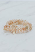 Wings Hawaii Sunstone stretchy beaded bracelet with 14k gold-filled tag. Crystal chakra healing. Boho-chic spiritual jewelry handmade in Maui.