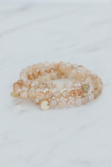 Wings Hawaii Sunstone stretchy beaded bracelet with 14k gold-filled tag. Crystal chakra healing. Boho-chic spiritual jewelry handmade in Maui.