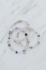 Wings Hawaii Light Super Seven stretchy beaded bracelet with 14k gold-filled tag. Crystal chakra healing. Boho-chic spiritual jewelry hand made in Maui. thumbnail