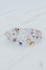 Wings Hawaii Light Super Seven stretchy beaded bracelet with 14k gold-filled tag. Crystal chakra healing. Boho-chic spiritual jewelry hand made in Maui.