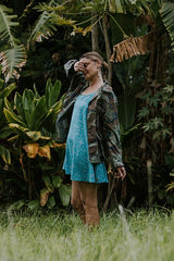 Wings Hawaii model wearing trapeze mini dress in ulu and plumeria print in blue surf thumbnail