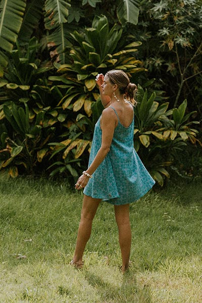 Wings Hawaii model in trapeze mini dress in surf color