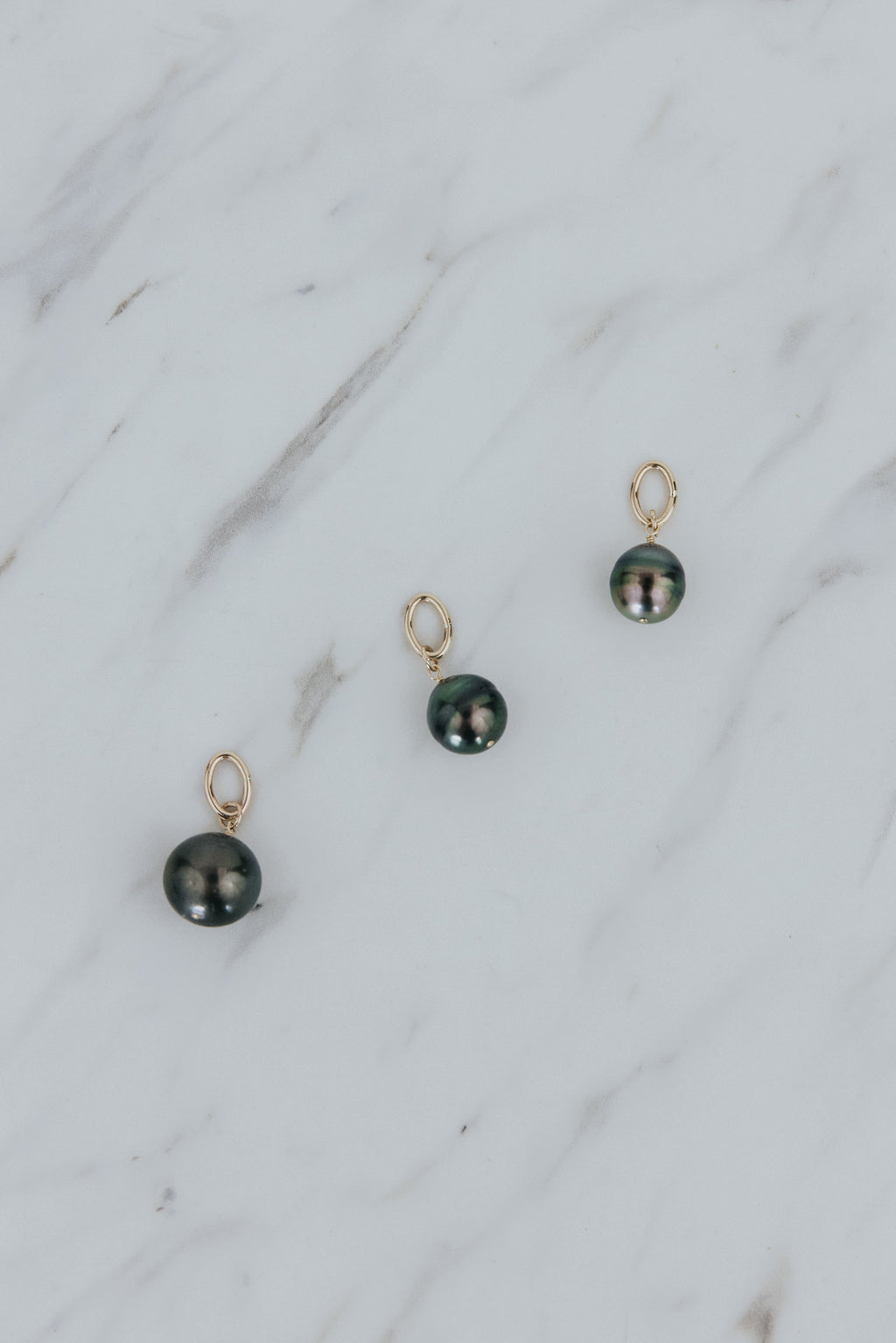 Wings Hawaii Tahitian pearl necklace charms in 14k gold-filled. Keshi teardrop, Baroque, and Round varieties. Fine jewelry handcrafted in Maui. Beach-chic charm necklaces handmade in Hawaii. 