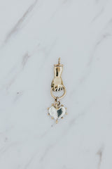 Wings Hawaii Stolen Heart necklace charm in solid 14k yellow gold and sterling silver. Hand-carved. Fine jewelry expertly handmade in Maui. 