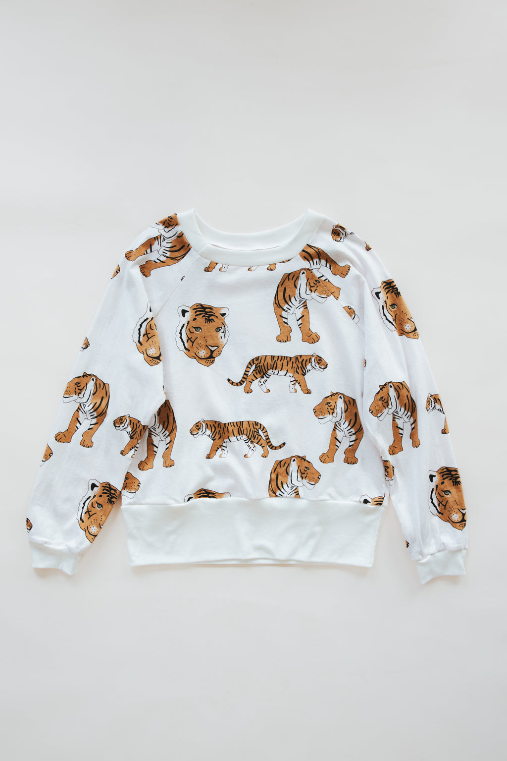 Wings Hawaii women's Wandering Tiger print raglan. Crew neck, long sleeve, lightweight top. Original artwork designed in Maui, made in Bali. Small batch, sustainable, eco-conscious apparel. 