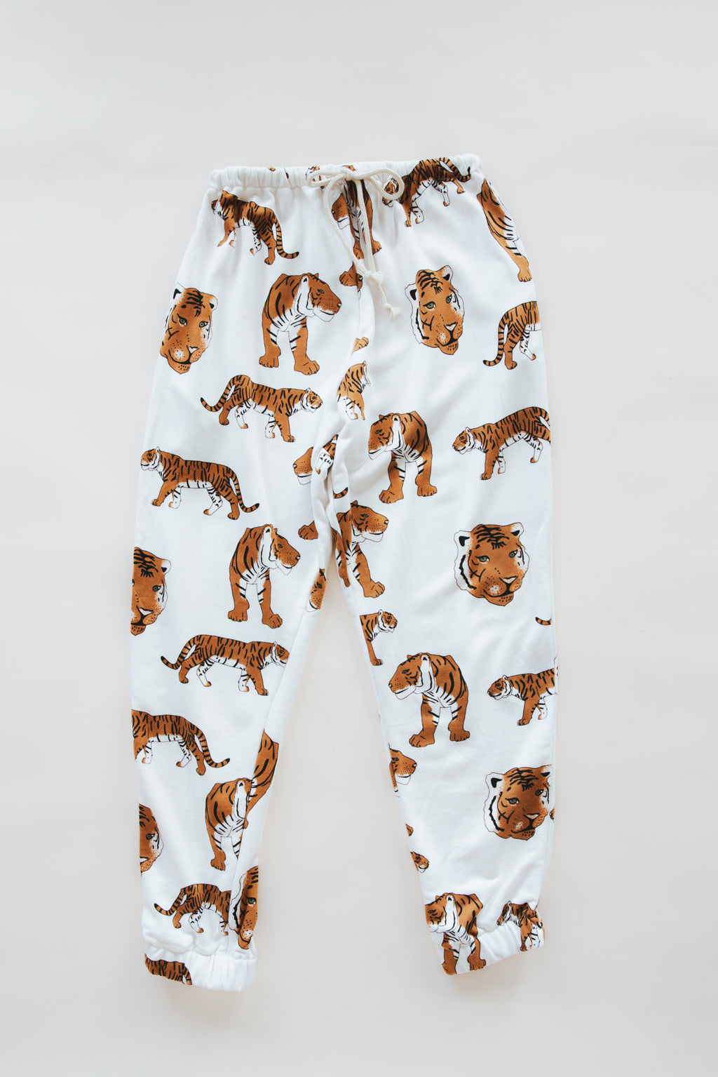 Wings Hawaii tiger joggers in bamboo french terry. Drawstring waist, mid-rise, with pockets. Designed in Maui, sewn in Bali. Unique loungewear pants. Sustainable slow fashion proudly handmade in small batches. 