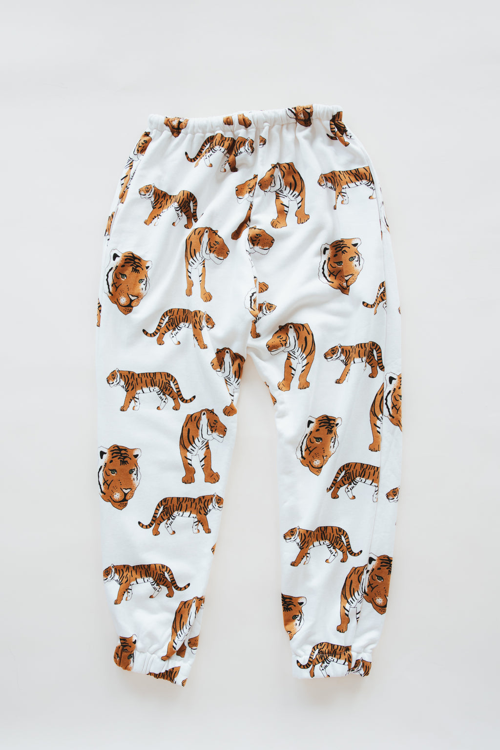 Wings Hawaii tiger joggers in bamboo french terry. Drawstring waist, mid-rise, with pockets. Designed in Maui, sewn in Bali. Unique loungewear pants. Sustainable slow fashion proudly handmade in small batches. 