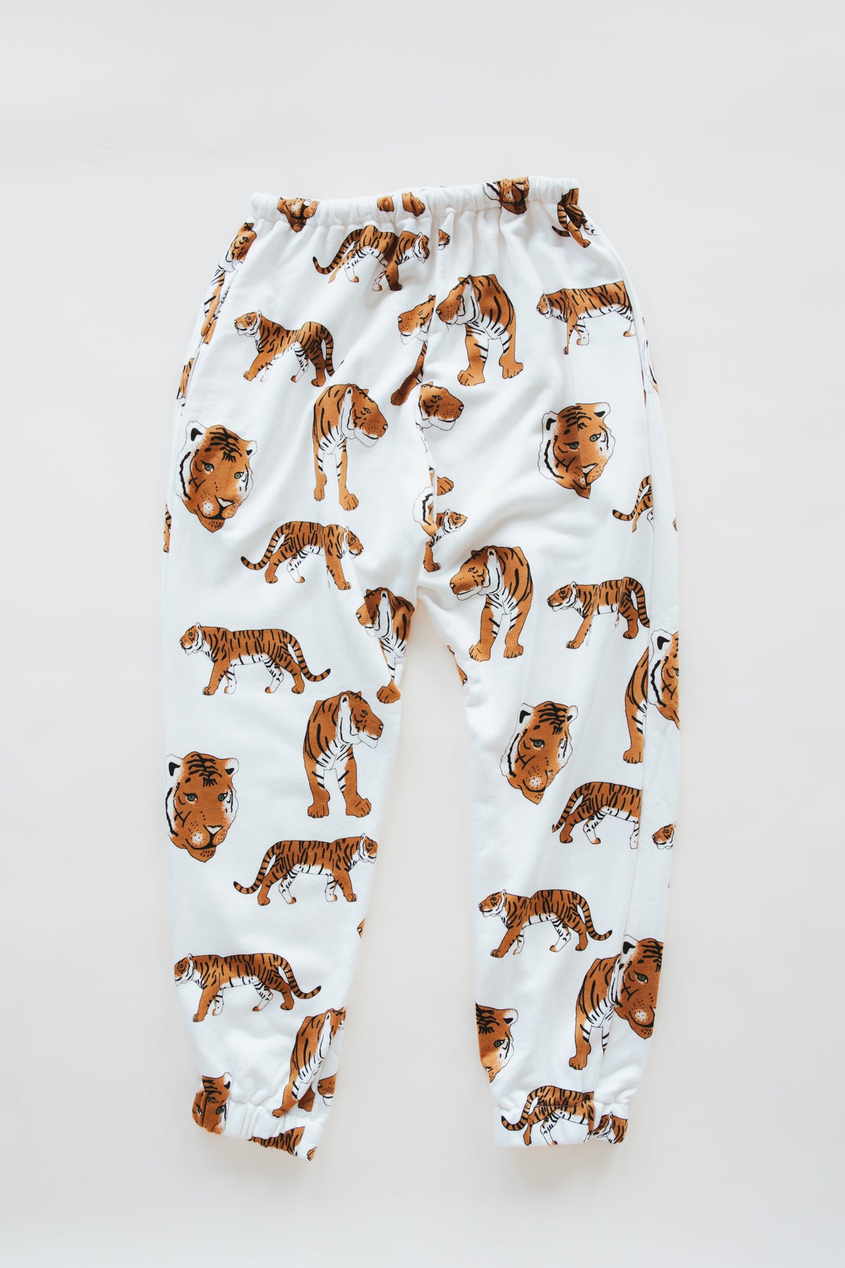 Wings Hawaii tiger joggers in bamboo french terry. Drawstring waist, mid-rise, with pockets. Designed in Maui, sewn in Bali. Unique loungewear pants. Sustainable slow fashion proudly handmade in small batches. 