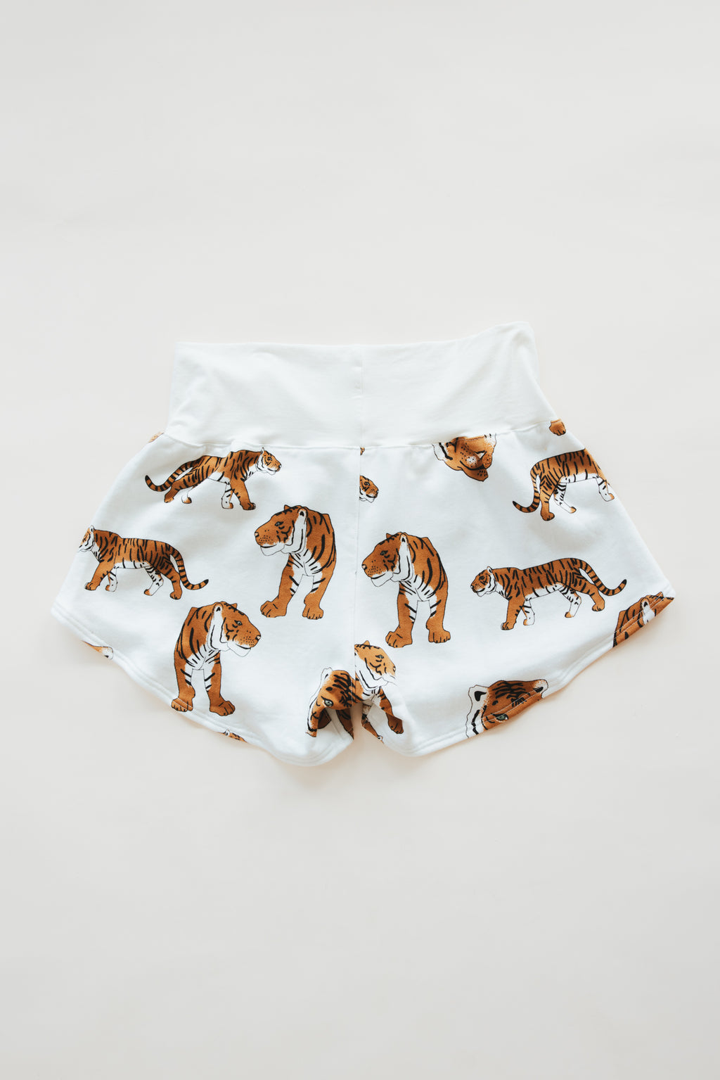 Wings Hawaii women's Pau Hana shorts in tiger print in french terry. Original artwork designed in Maui, made in Bali. Small batch, sustainable, eco-conscious apparel. 