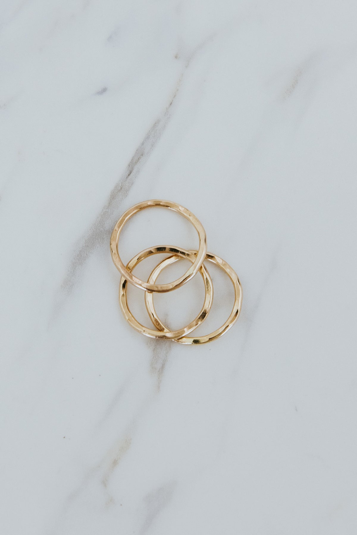 Wings Hawaii ti leaf stacking rings in 14k gold-filled or sterling silver. Fine jewelry handmade in Maui. Beachy, boho, organic, freeform wavy-shaped rings. 