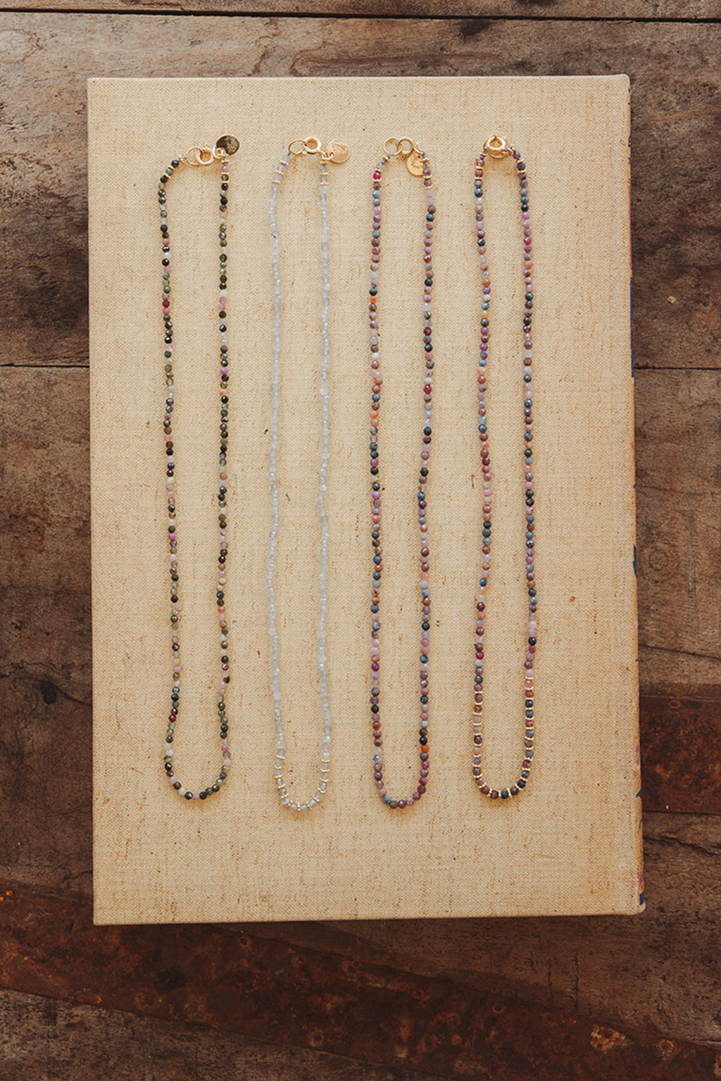 Wings Hawaii Wanderlust Beaded Strands. Thin, colorful, handmade beaded strand necklaces or bracelets. Available in Sapphire, Tourmaline, or Labradorite varieties. Fine jewelry handcrafted in Maui. 