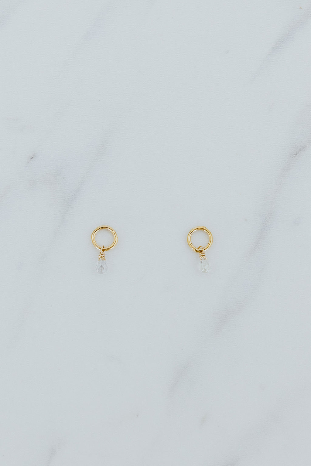Wings Hawaii tiny diamond earring charms in 14k yellow gold-filled jump rings. Fine jewelry handmade in Maui. Charm Bar Collection for modern charm earrings made in Hawaii. 