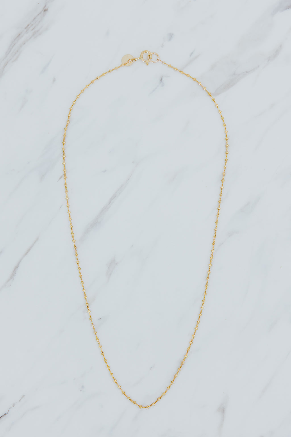 Wings Hawaii tiny satellite chain necklace in 14k gold-filled. Fine jewelry handcrafted with aloha in Maui. Wear solo, layered, or add charms to customize. High quality jewelry made in Hawaii. 